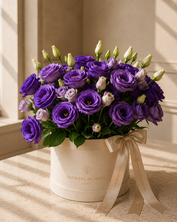 Violet and Lilac Lisianthus Hat Box by Flowers By Maya, layered purple and lilac lisianthus in a cream suede hat box