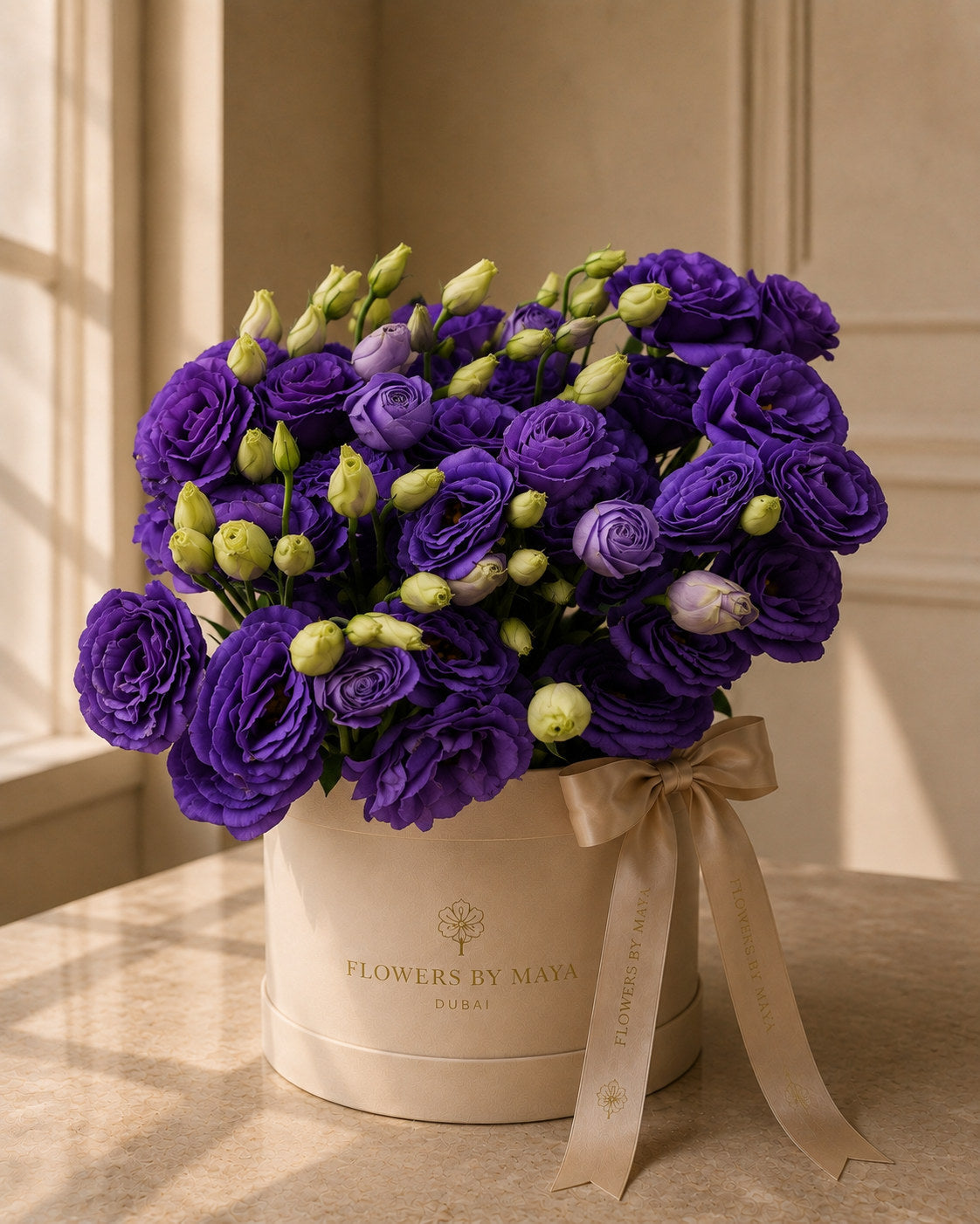Purple Lisianthus Hat Box by Flowers By Maya, deep violet lisianthus with green buds in a cream suede hat box