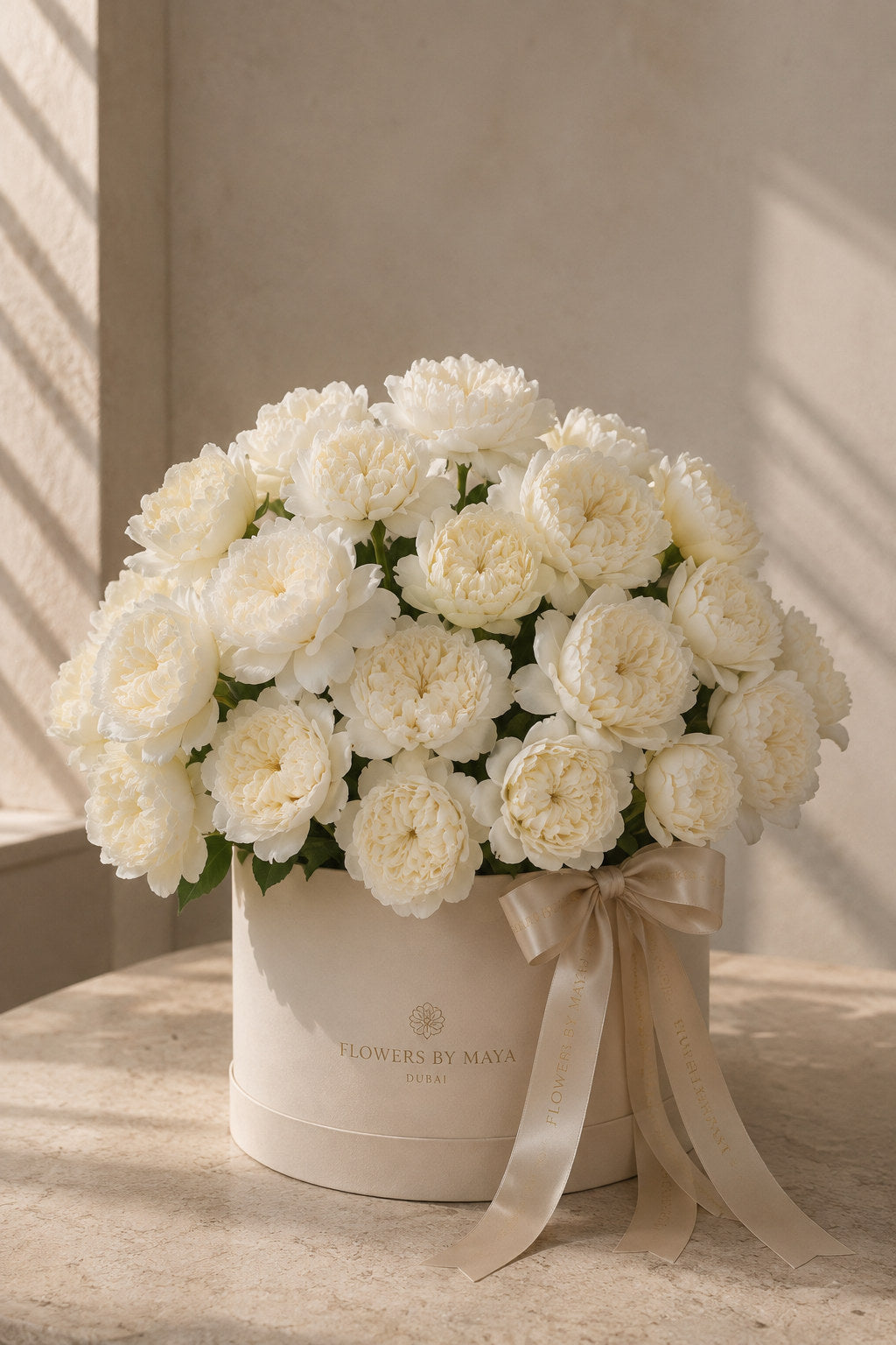 Ivory Garden Rose Hat Box by Flowers By Maya, cream peony-form garden roses in a cream suede hat box