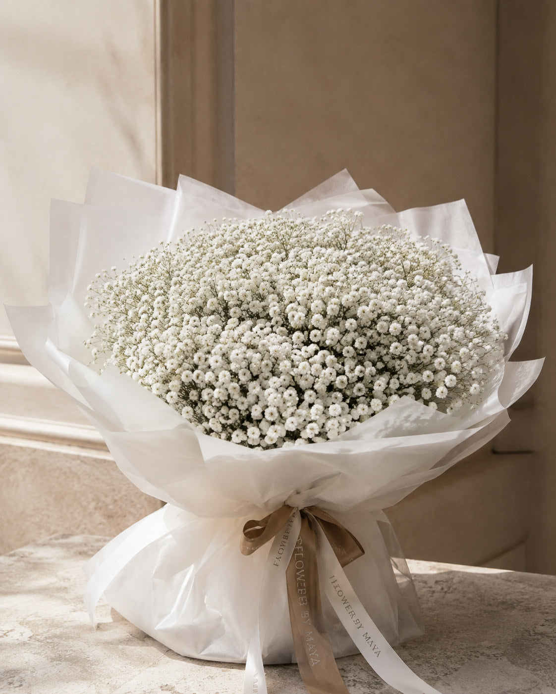 Baby's Breath Bouquet by Flowers By Maya, dense white gypsophila cloud in white tissue wrap