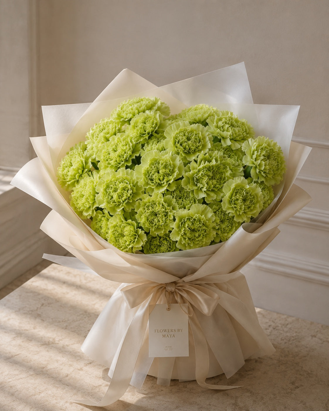 Lime Couture by Flowers By Maya, lime green carnations in ivory tissue wrap with satin ribbon